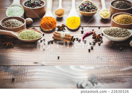 Beautiful colorful spices in wooden spoons 22630326