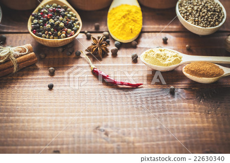 Beautiful colorful spices in wooden spoons  22630340