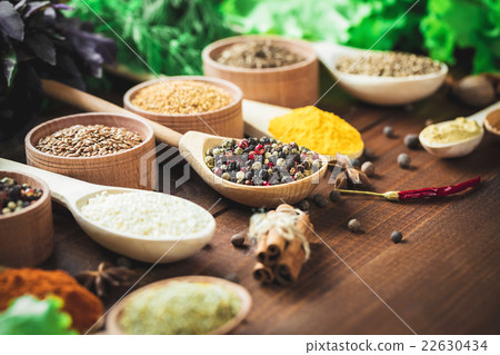 Beautiful colorful spices in wooden spoons  22630434