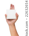 Couple of fingers with painted smiley holding note 22632654