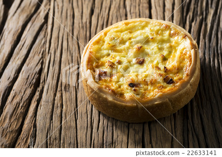 Homemade quiche on a rustic background. Homemade quiche on a rustic background. 22633141