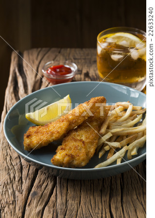 Freshly cooked fish and chips. Freshly cooked fish and chips. 22633240