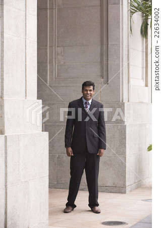 Indian business man in modern Asian city Indian business man in modern Asian city 22634002