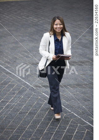 Above view of a Filipino businesswoman walking. Above view of a Filipino businesswoman walking. 22634560