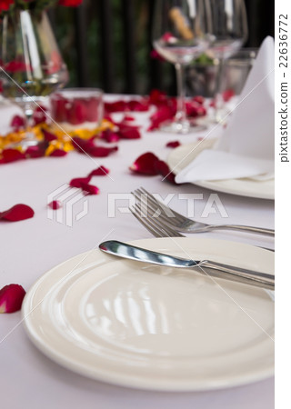 White plate with silverwares set on table decorate White plate with silverwares set on table decorate 22636772
