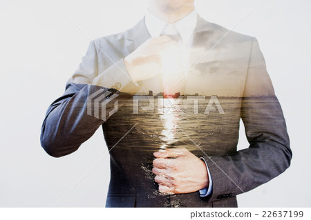 Double Exposure of businessman in offshore sunset Double Exposure of businessman in offshore sunset 22637199