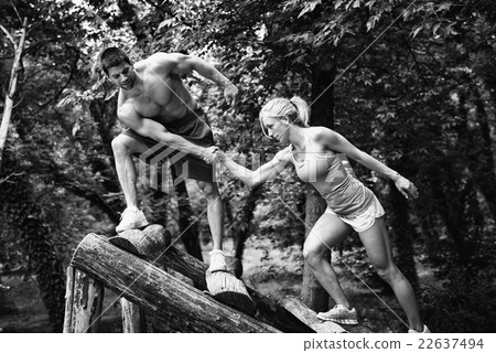 Crossfit couple on obstacle course Crossfit couple on obstacle course 22637494