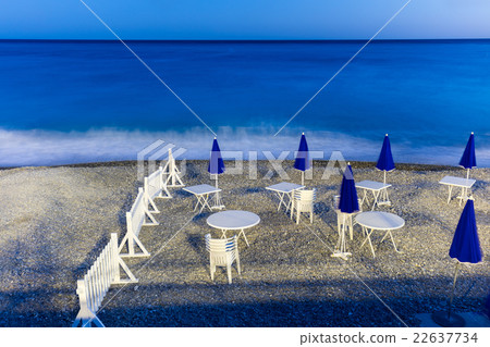 Night beach with parasols, tables ans chairs Night beach with parasols, tables ans chairs 22637734