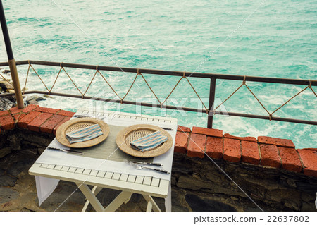 Served table for two with two plates Served table for two with two plates 22637802