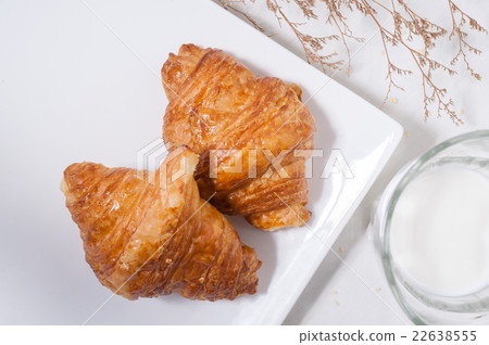 croissants and a glass of milk 22638555