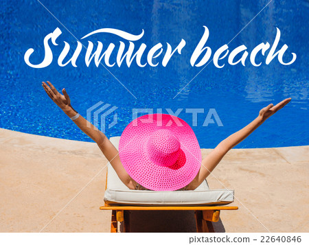 happy woman with hat sunbathing on a sun lounger 22640846