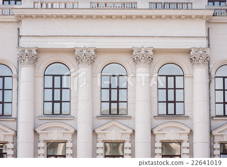facade of an old building with columns and windows facade of an old building with columns and windows 22641019