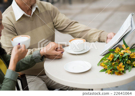 Reading newspaper together Reading newspaper together 22641064