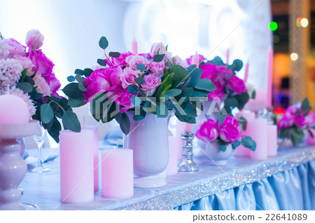 decor of flowers on wedding table in a restaurant decor of flowers on wedding table in a restaurant 22641089