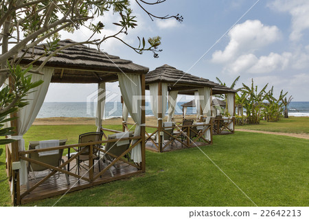Beautiful bungalows for relaxation on sea beach Beautiful bungalows for relaxation on sea beach 22642213