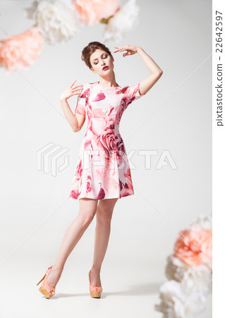 Elegant woman posing in beautiful dress Elegant woman posing in beautiful dress 22642597