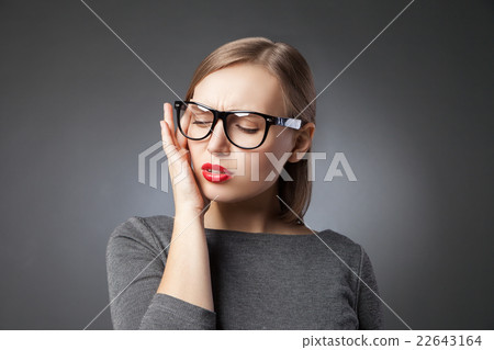 Beautiful young woman portrait. Headache or 22643164