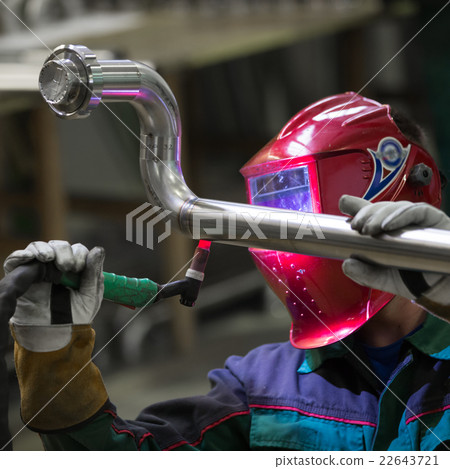 Industrial worker welding in metal factory. 22643721