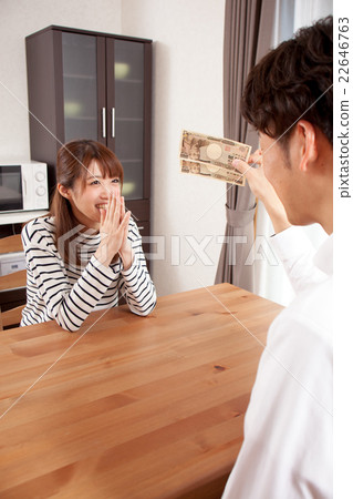 Husband who hands pocket money to his wife Husband who hands pocket money to his wife 22646763