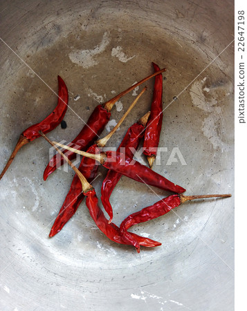 Dried red chillies in old metal bowl Dried red chillies in old metal bowl 22647198