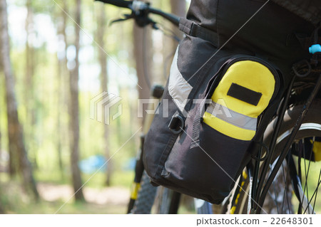 Bicycle tourist with loaded bike Bicycle tourist with loaded bike 22648301
