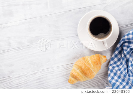 Fresh croissant and coffee 22648503