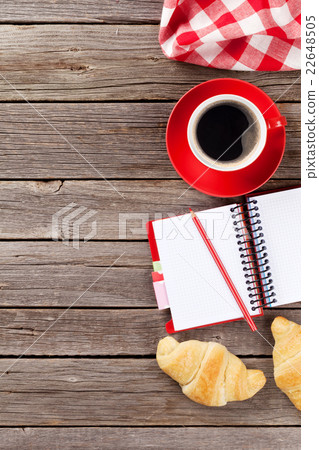 Fresh croissants, coffee and notepad Fresh croissants, coffee and notepad 22648505