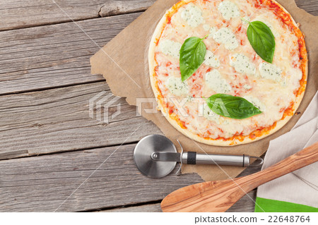 Quattro fromaggi pizza with basil 22648764