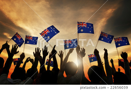 Group of People Waving Australian Flags in Back Lit Group of People Waving Australian Flags in Back Lit 22656039