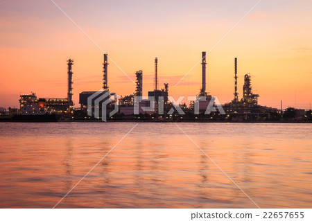 Oil refinery along the river at Dusk 22657655