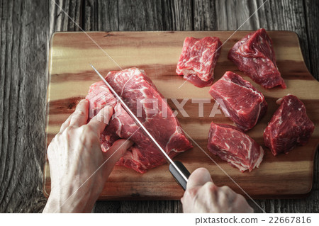 Cutting angus beef on the wooden table horizontal 22667816