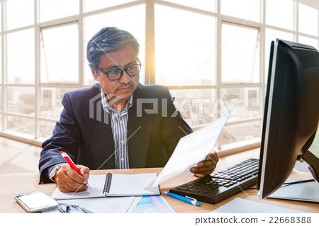 senior working man reading business paper report senior working man reading business paper report 22668388