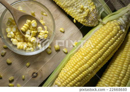 Corn and corn slide in a cup with wooden spoon 22668680