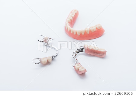 Set of dentures on white background 22669106