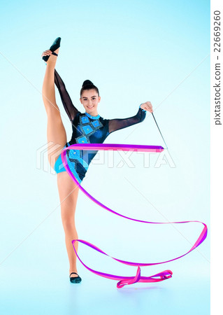 The girl doing gymnastics dance with colored The girl doing gymnastics dance with colored 22669260
