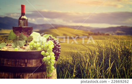 Grape on a wooden barrel. Grape on a wooden barrel. 22669262