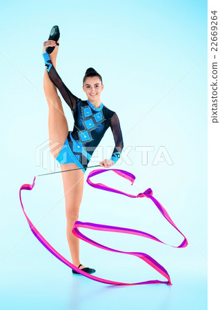 The girl doing gymnastics dance with colored The girl doing gymnastics dance with colored 22669264