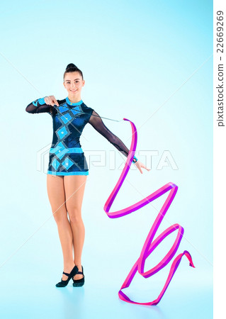 The girl doing gymnastics dance with colored The girl doing gymnastics dance with colored 22669269