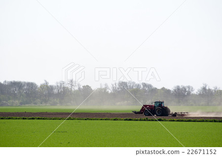 Tractor in a dry landscape Tractor in a dry landscape 22671152