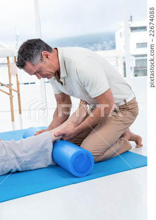 Physiotherapist giving physiotherapy to pregnant woman Physiotherapist giving physiotherapy to pregnant woman 22674088
