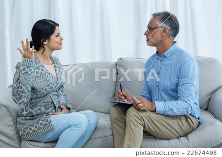 Therapist consoling a woman Therapist consoling a woman 22674498