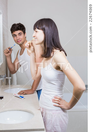 Bathroom routine for happy young couple Bathroom routine for happy young couple 22674869