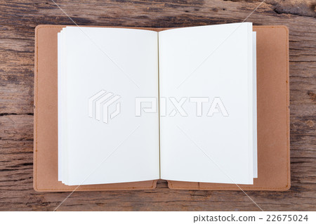 Blank empty notepad on wood background.. 22675024