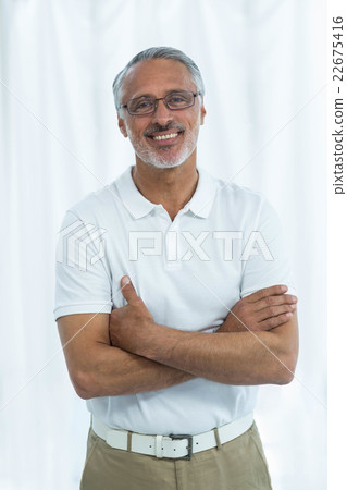 Physiotherapist standing with arms crossed 22675416