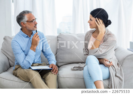 Therapist consoling a woman Therapist consoling a woman 22675533