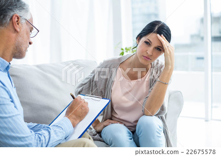 Therapist consoling a woman Therapist consoling a woman 22675578