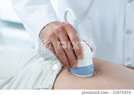 Pregnant woman undergoing ultrasound test Pregnant woman undergoing ultrasound test 22675859