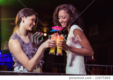 Happy young women having cocktail 22675869