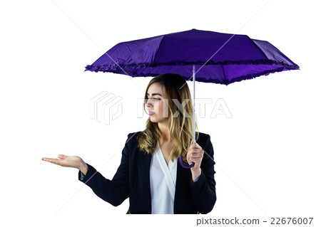 Woman using an umbrella Woman using an umbrella 22676007