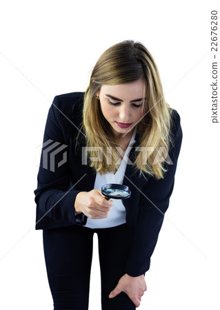 Woman using magnifying glass 22676280
